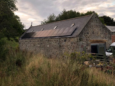 Stone house with solar panels